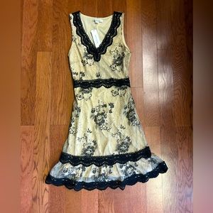 NWT Francesca’s antique look lace dress. Black and cream color. Size XXS